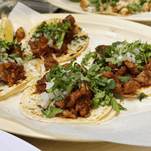 Authentic Mexican street tacos with cilantro and onion served in Dallas